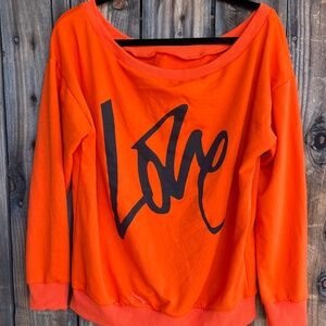 Bright orange off the shoulder top